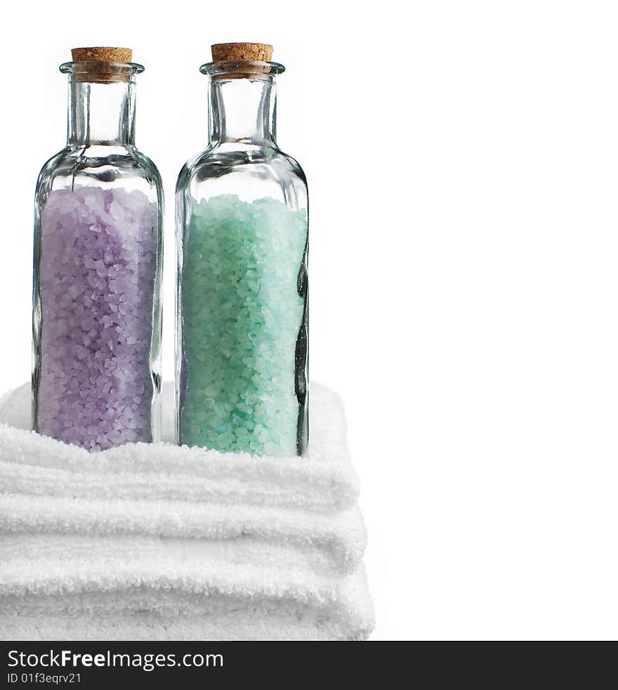 Bath towels and bath salt against a white background. Bath towels and bath salt against a white background.