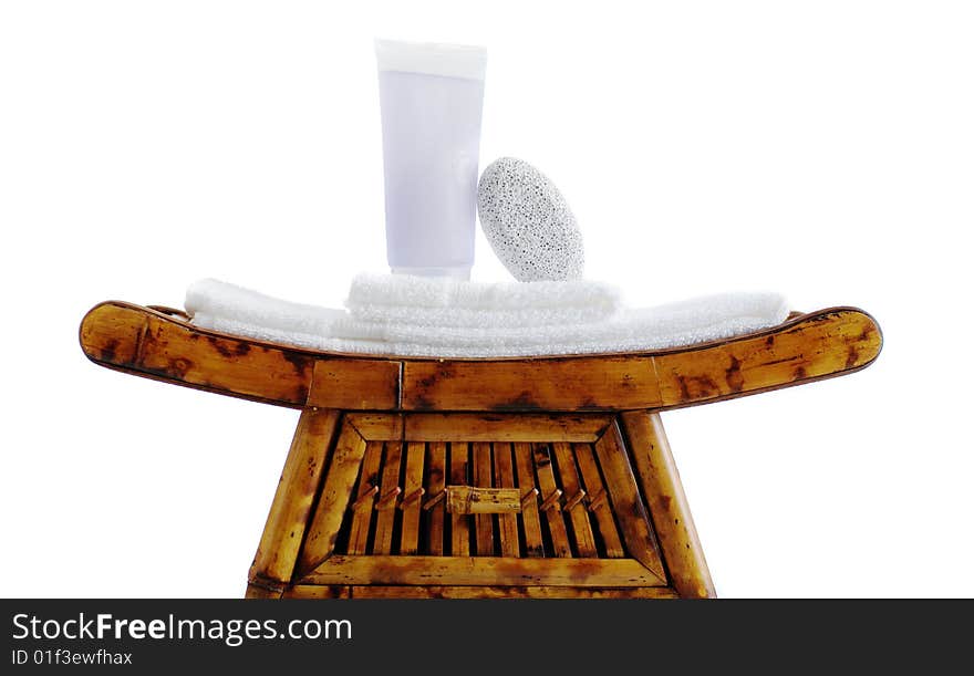 Bed and bath objects on top of an ornate stand. Bed and bath objects on top of an ornate stand.