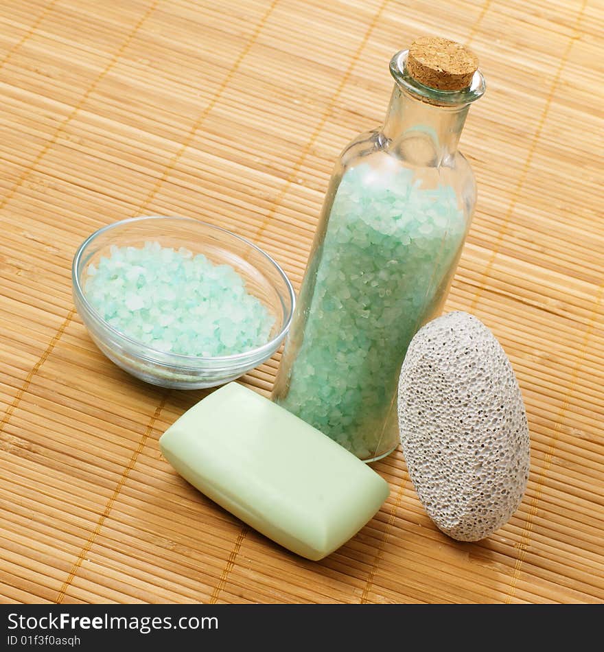 Bath products on display against a bamboo mat. Bath products on display against a bamboo mat.