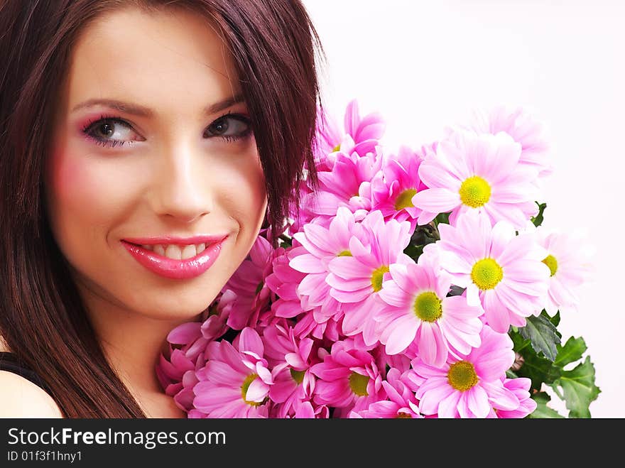 Attractive young woman face with flowers. Attractive young woman face with flowers