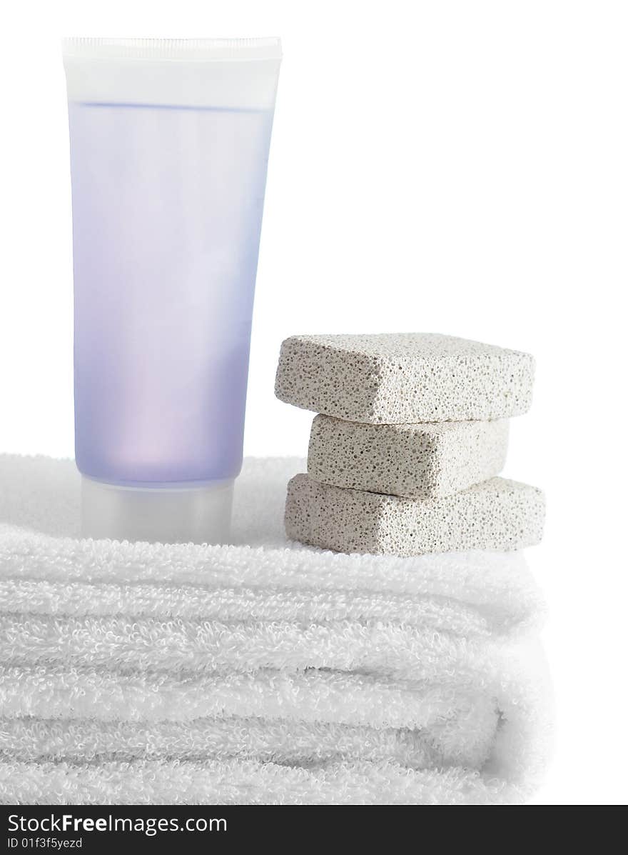 A spa scene on top of fluffy white towels against a white background.