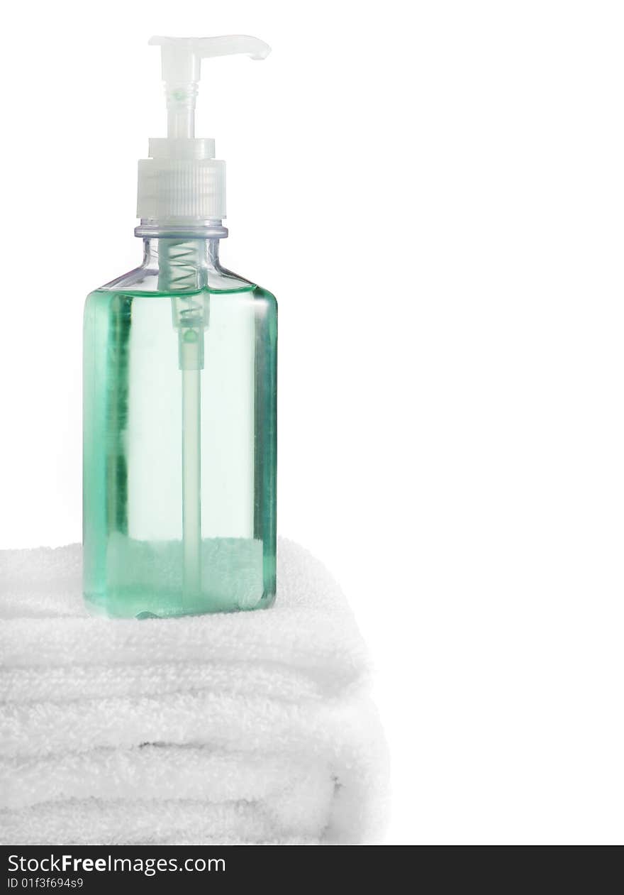 A spa scene on top of fluffy white towels against a white background.