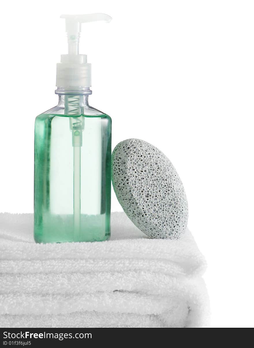 A spa scene on top of fluffy white towels against a white background.