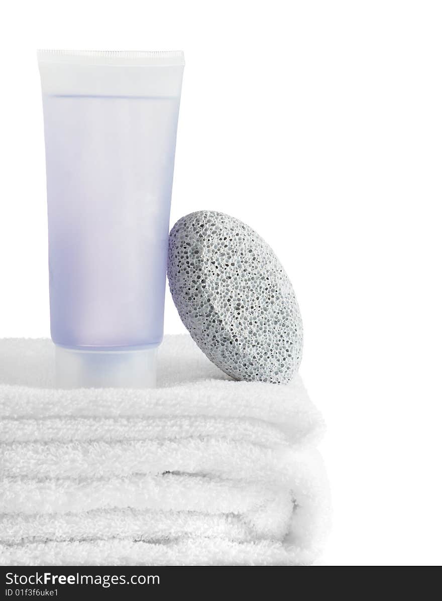 A spa scene on top of fluffy white towels against a white background.