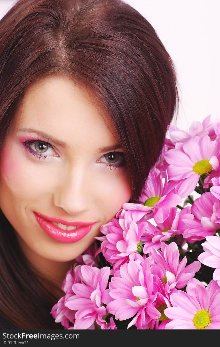 Attractive young woman face with flowers. Attractive young woman face with flowers