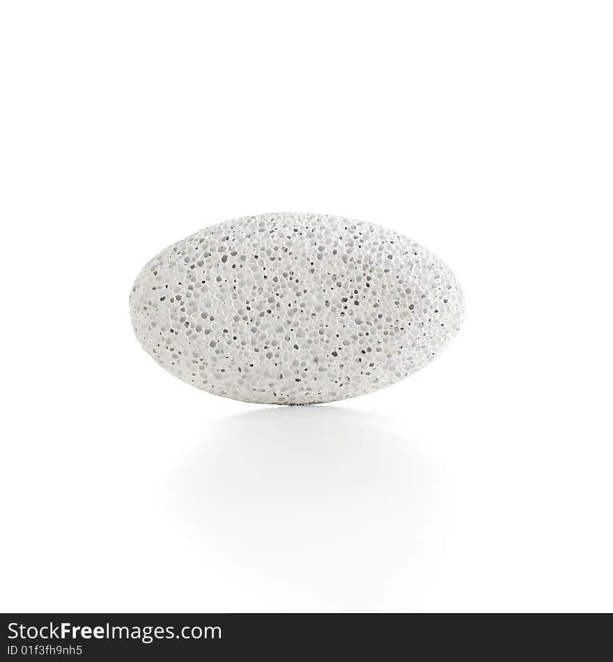 Pumice stones against a white background, sleight reflection. Pumice stones against a white background, sleight reflection.