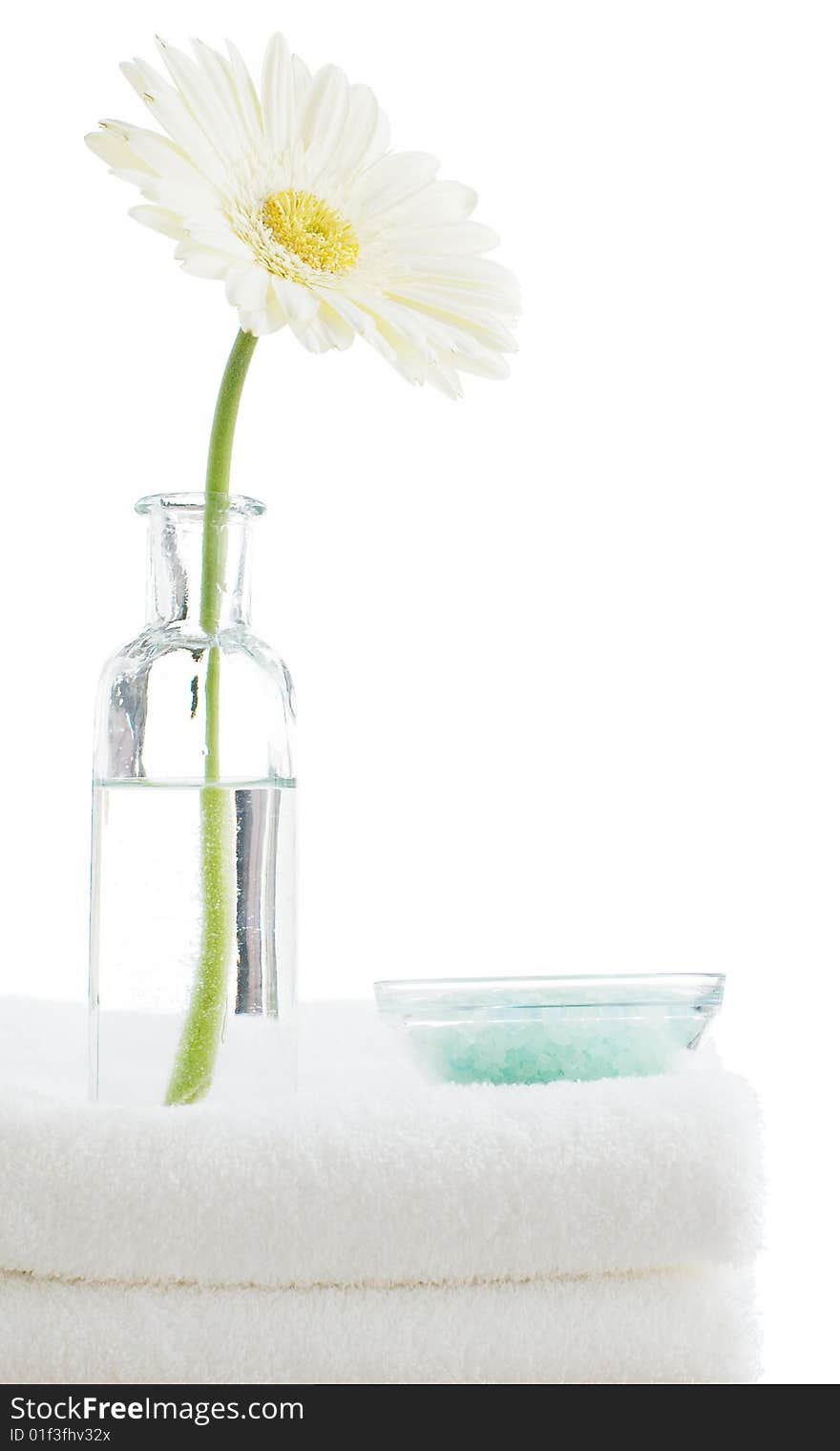 Towel stack with spa objects against a white background. Towel stack with spa objects against a white background.