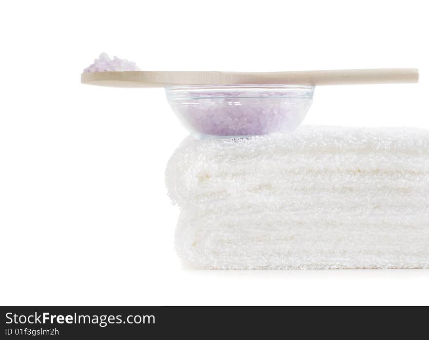 Towels and bath salt being displayed against a white background. Towels and bath salt being displayed against a white background.