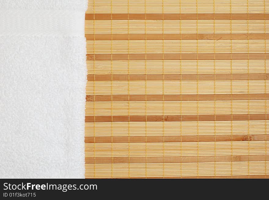 Brightly lit spa display on top of a bamboo mat.