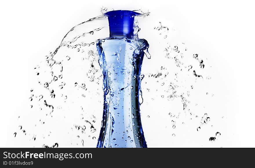 Blue shampoo bottle with water splashing around it. Blue shampoo bottle with water splashing around it.