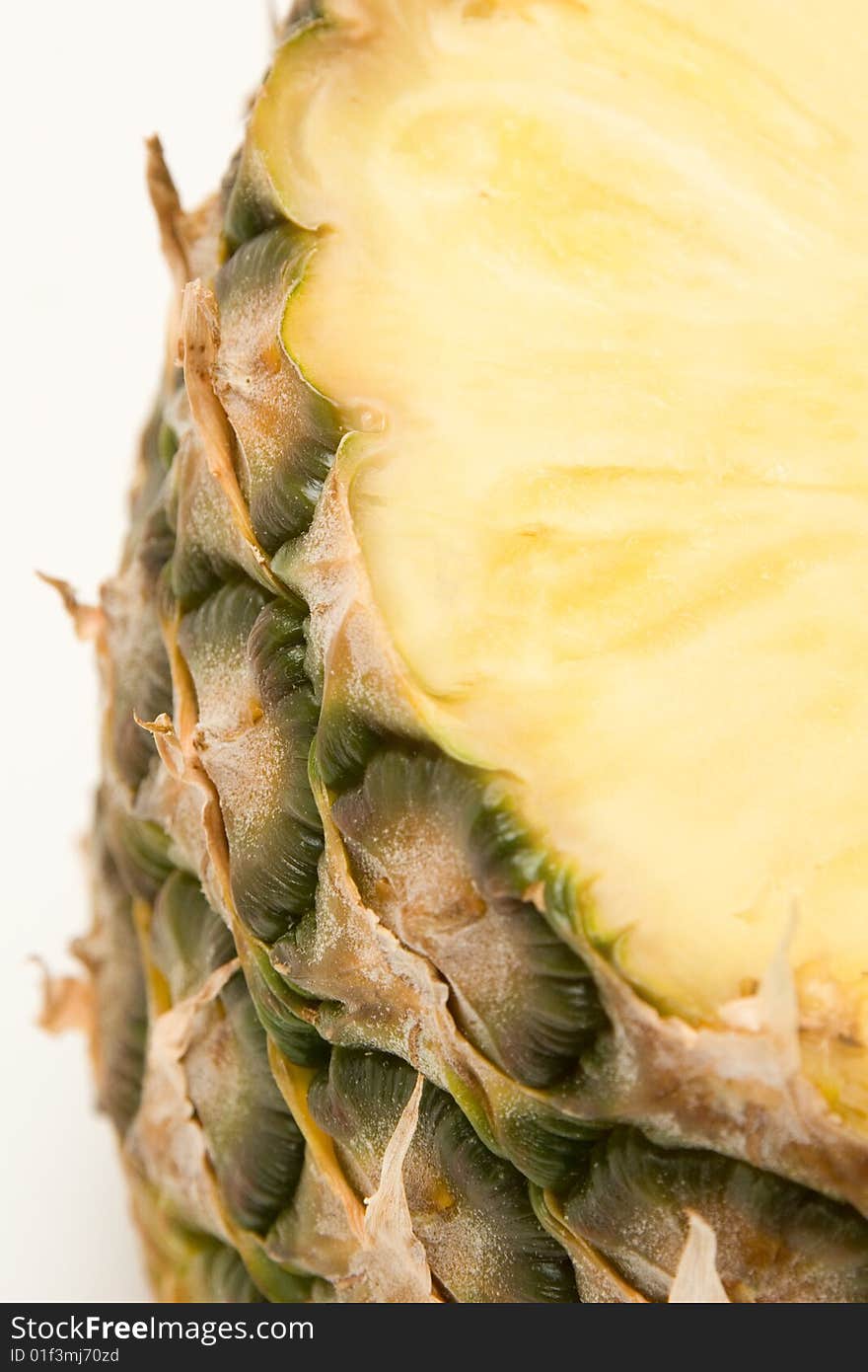 Pineapple close up isolated on white background.