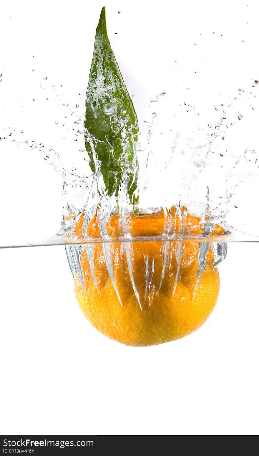 Tangerine in water with bubbles on white ground