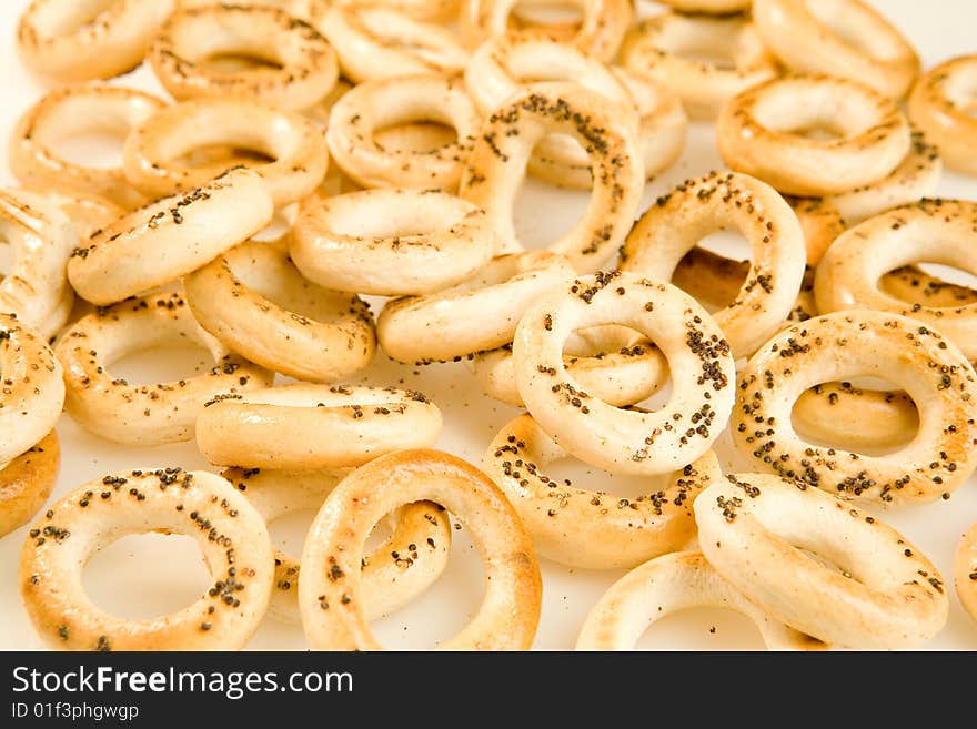 Bread-rings with poppyseed as a background