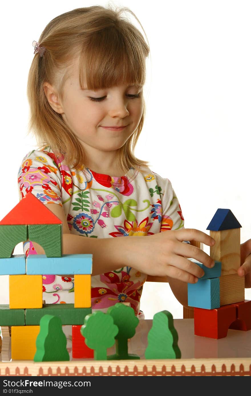 Little girl playing with cubes