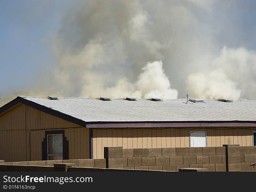 House on fire in a residential area. House on fire in a residential area