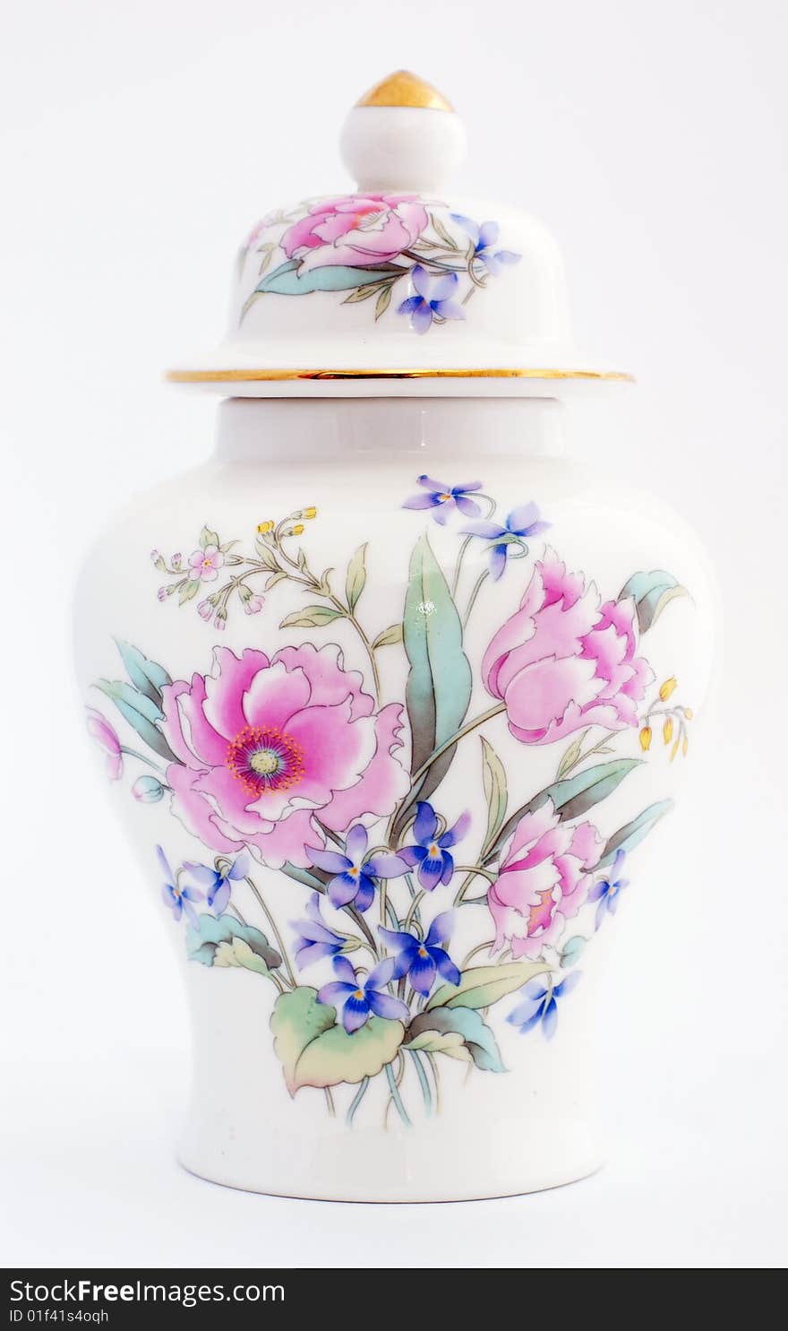 Oriental ginger jar with a floural motiff. Roses and other colorful flowers adorn the front of the jar, the lid has a gold top and a gold rim.