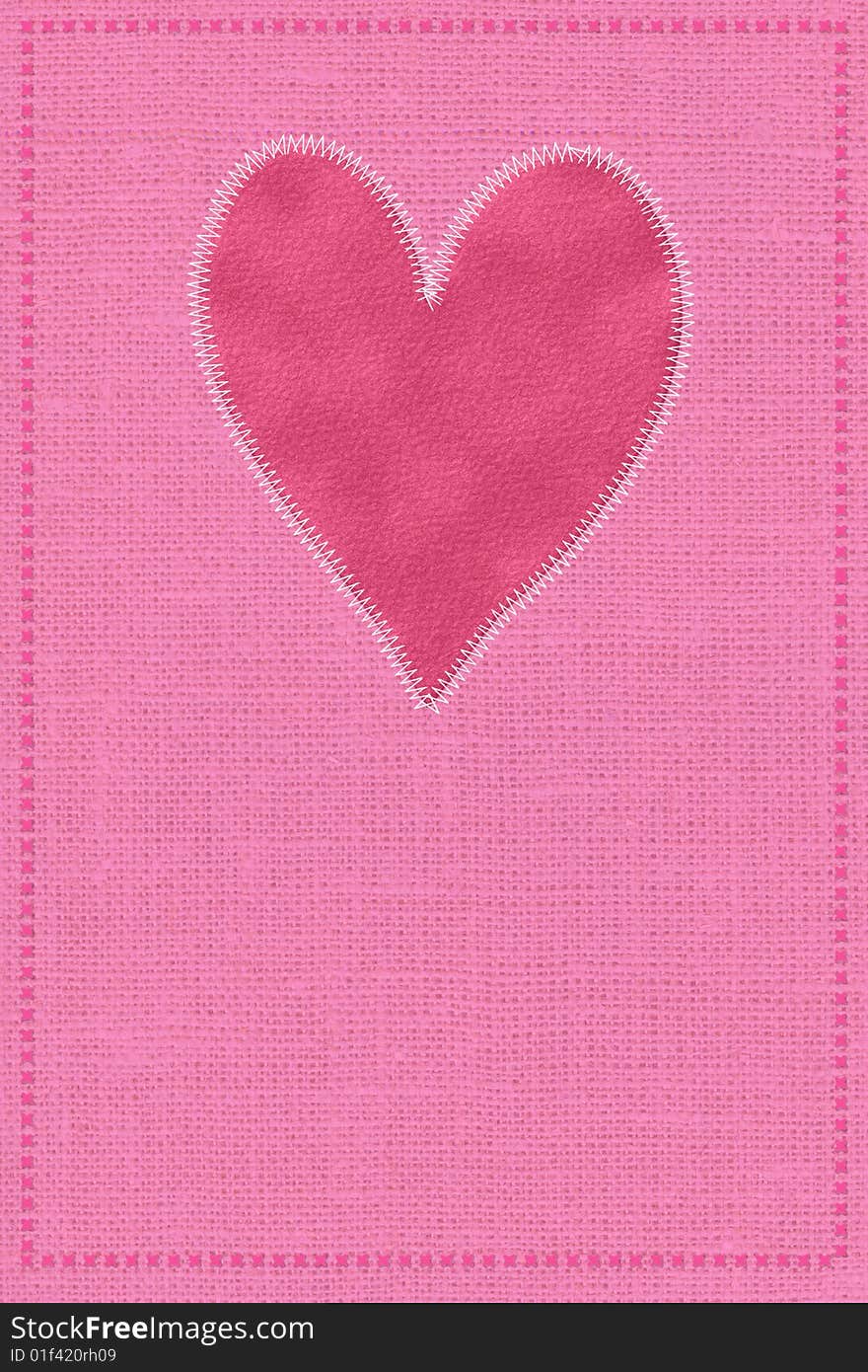 Postcard with a red heart on a fabric