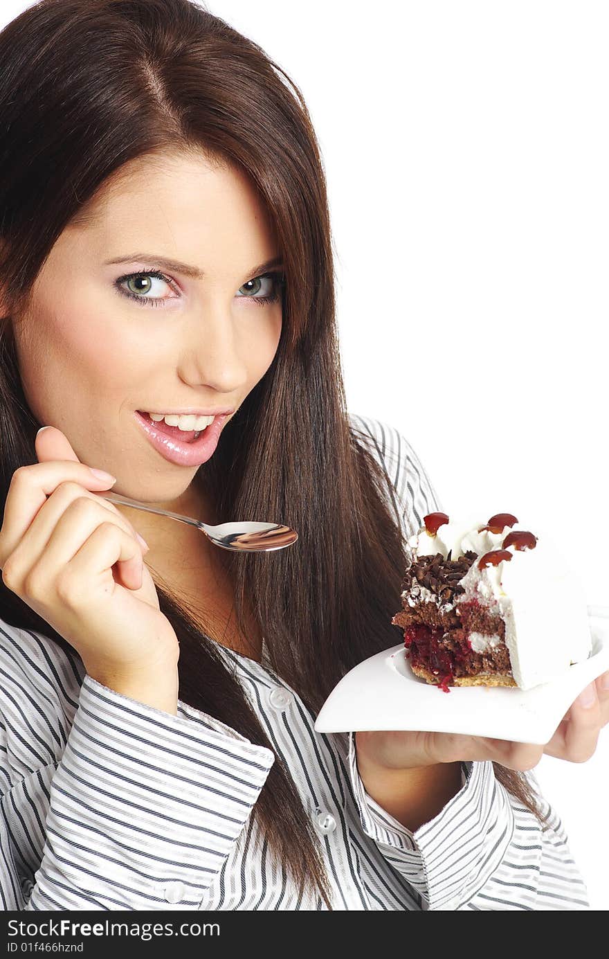 Businesswoman wearing white shirt eating the cake. Businesswoman wearing white shirt eating the cake.