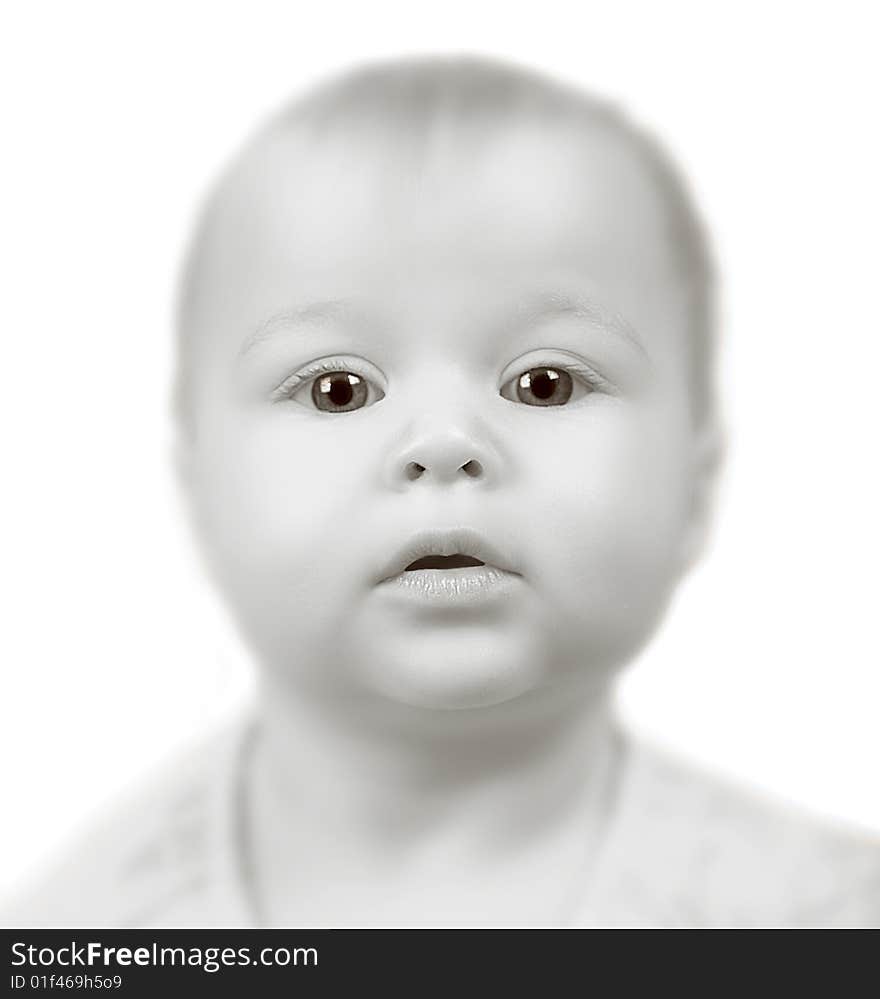 Bizarre Portrait of a Baby girl on white background with Very short focus.