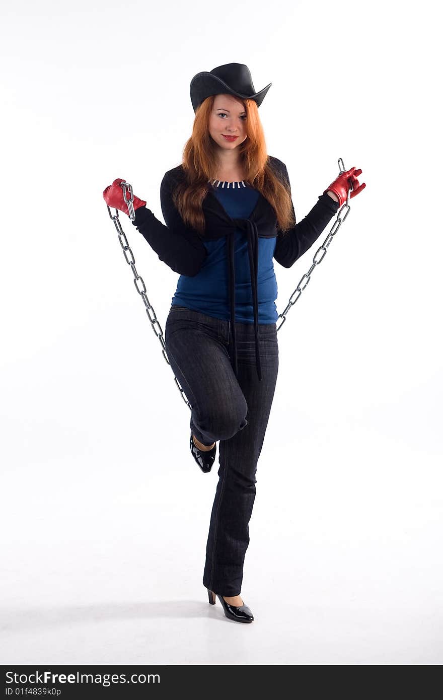 Young girl with red gloves, chain and black hat standing on white background. Young girl with red gloves, chain and black hat standing on white background