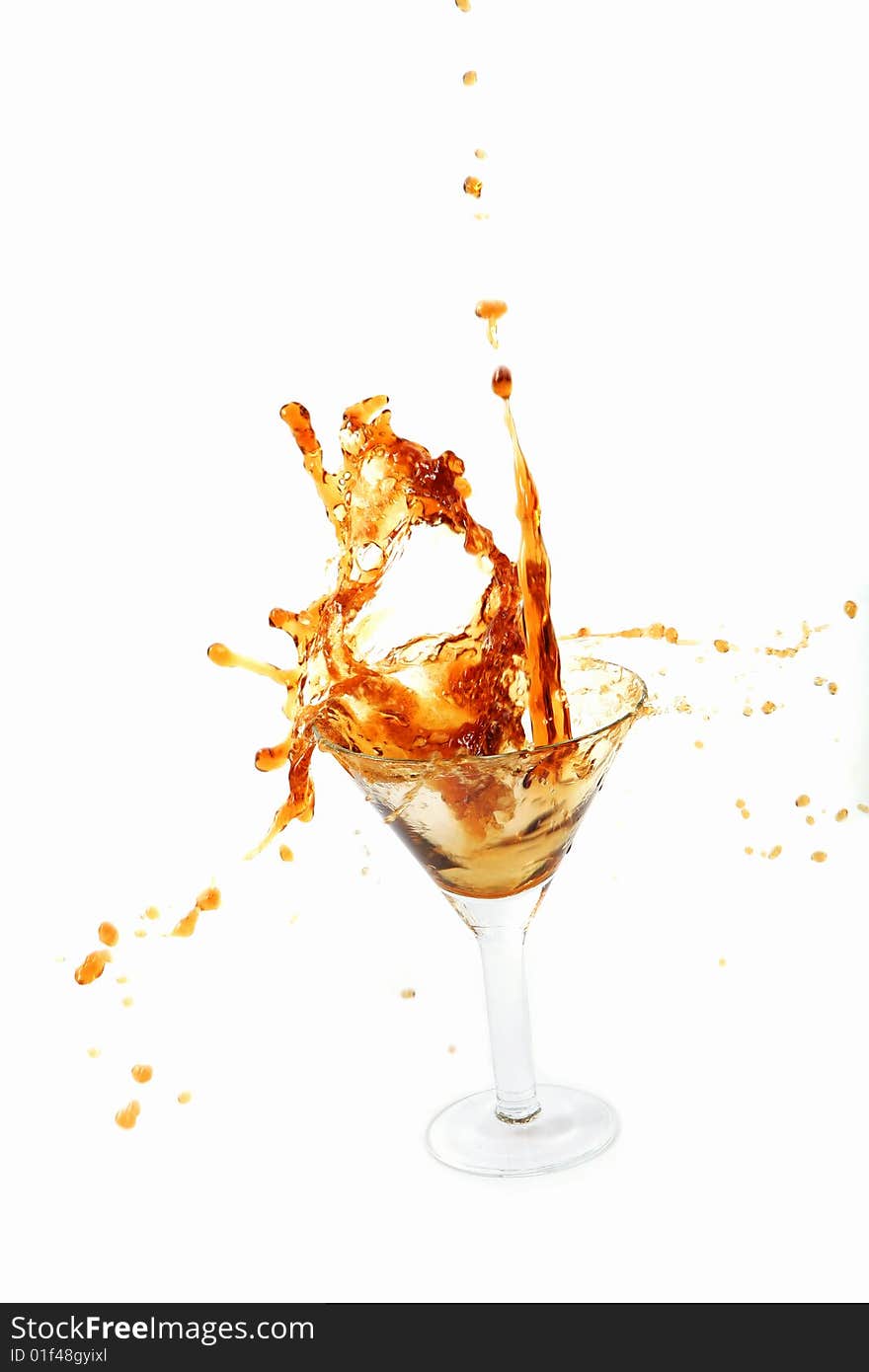 Wine being poured into a wine glass on white background