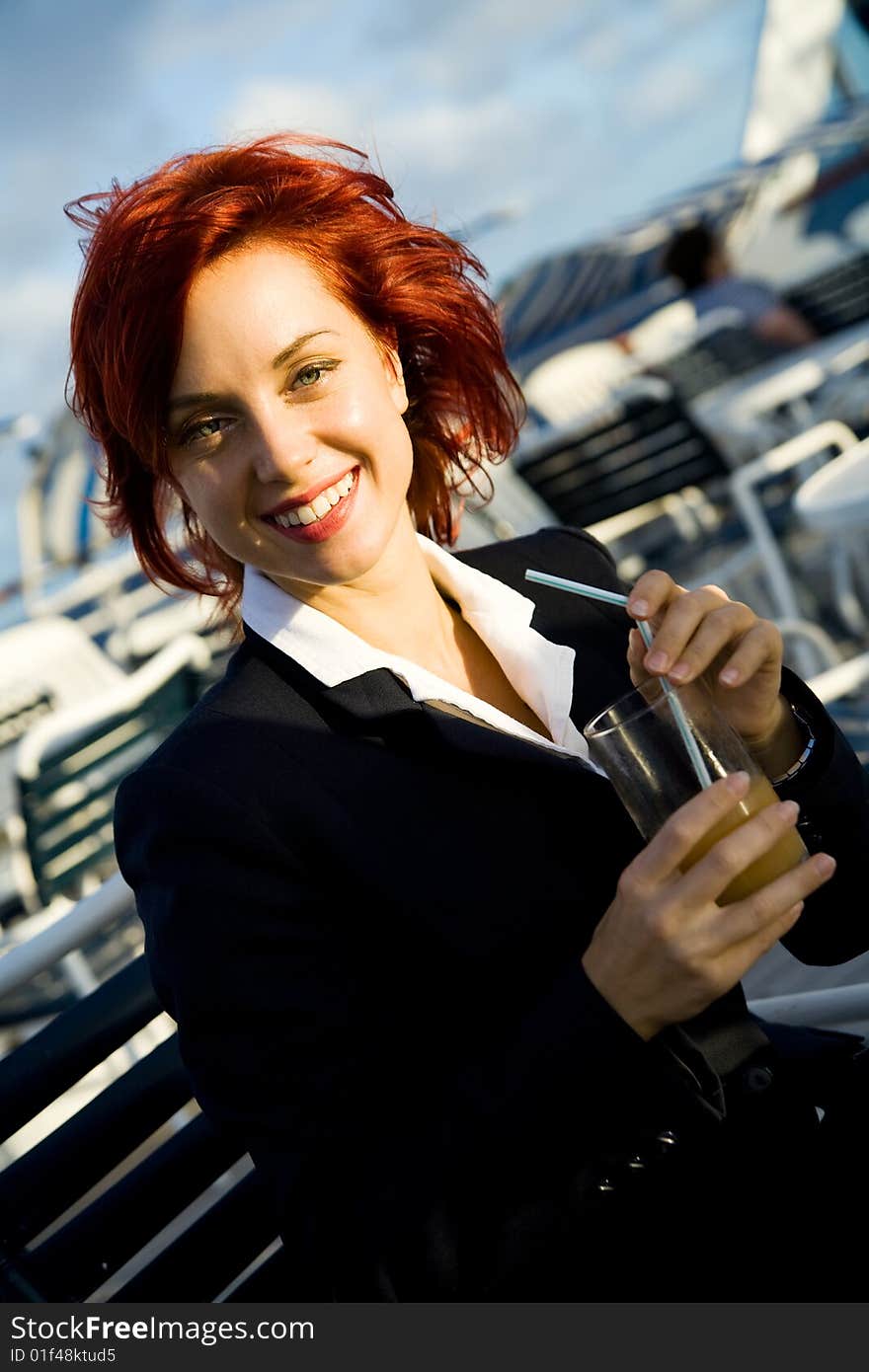 Young smiling caucasian woman with glass of juice. Young smiling caucasian woman with glass of juice