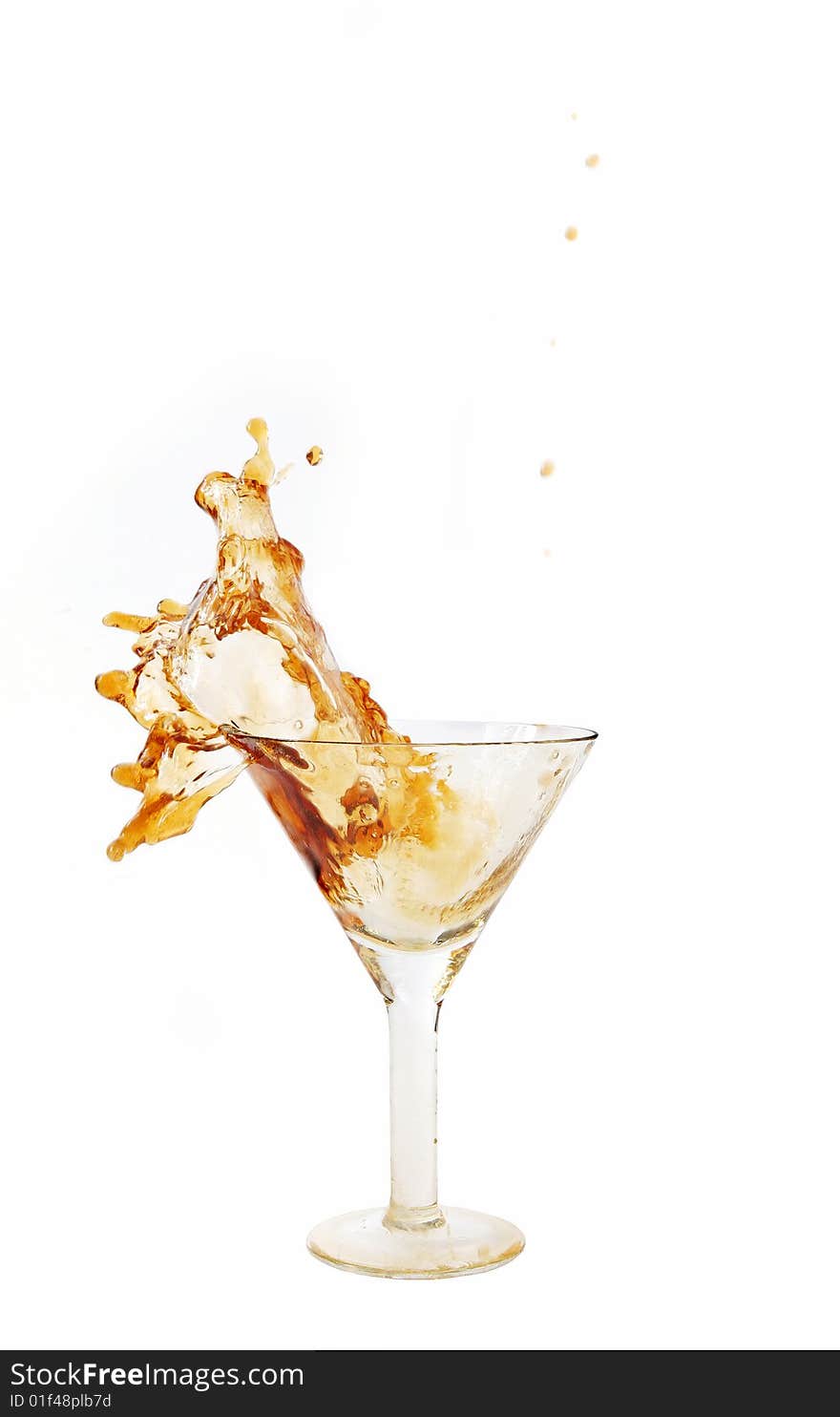 Wine being poured into a wine glass on white background