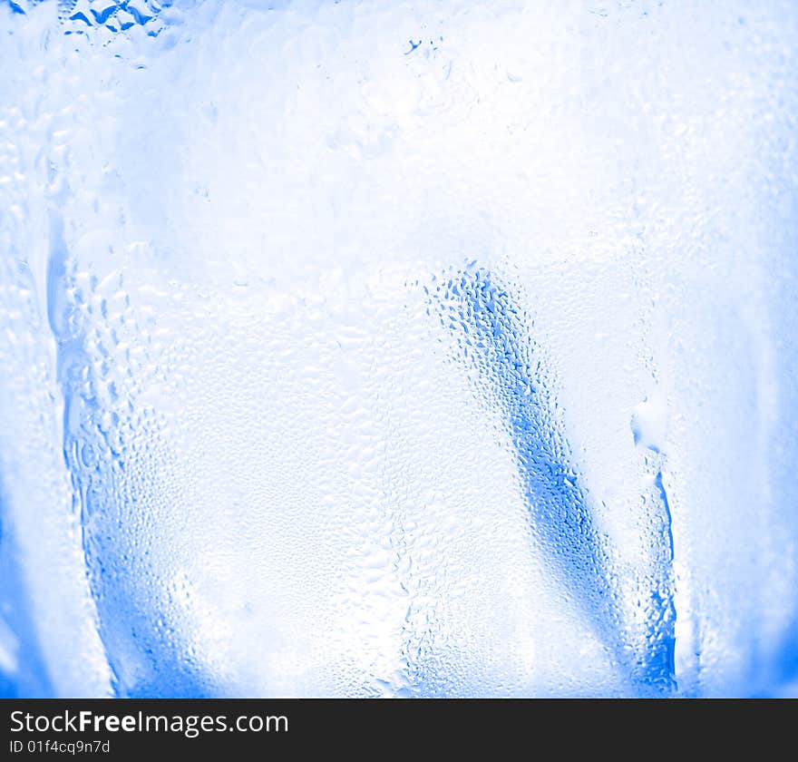 Water drops on glass with ice for background