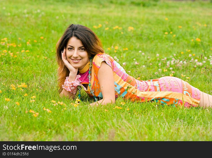 Beautiful Woman Lies On A Grass