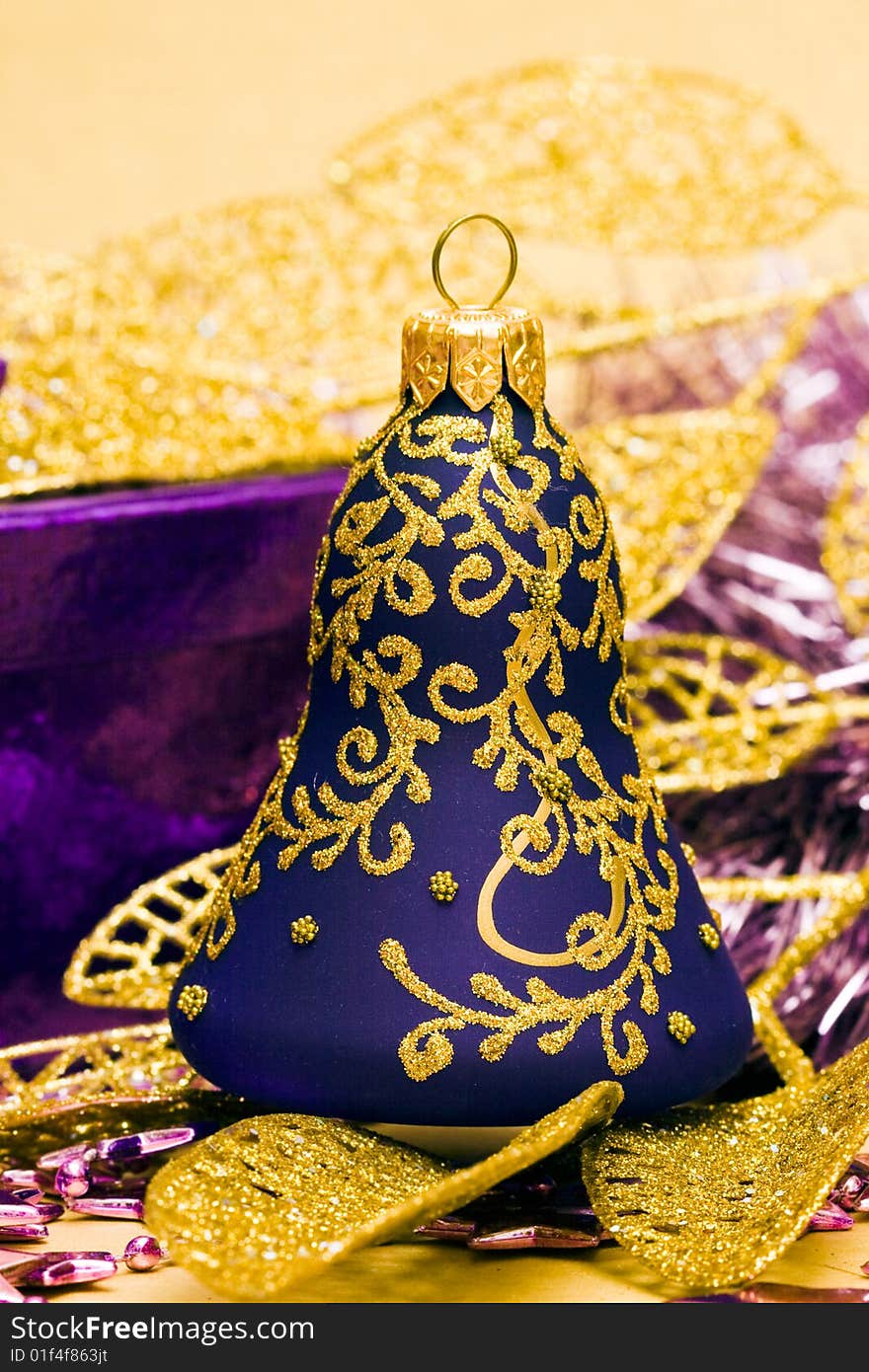 Violet celebration bells and golden leaves