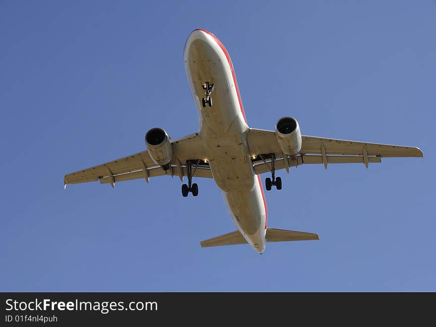 Modern airliner taking off in blue sky