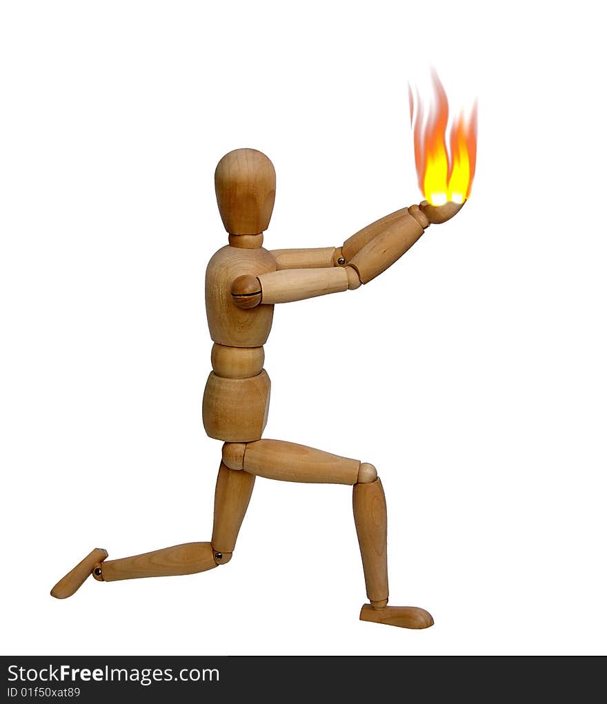 The wooden doll holds a flame in hands. The wooden doll holds a flame in hands