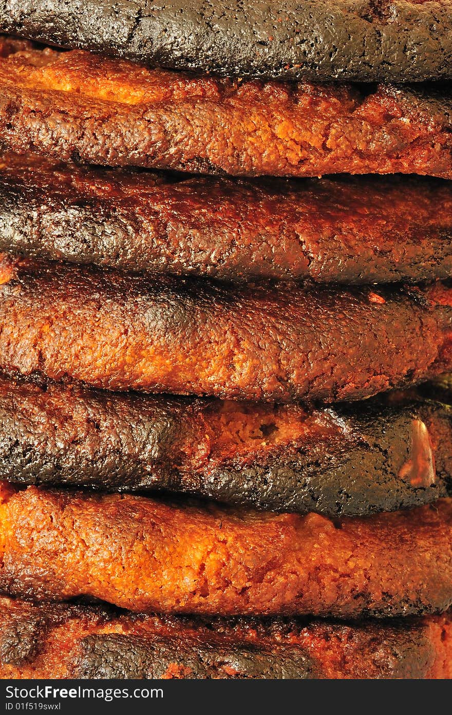 Macro image of a pile of burned biscuits.