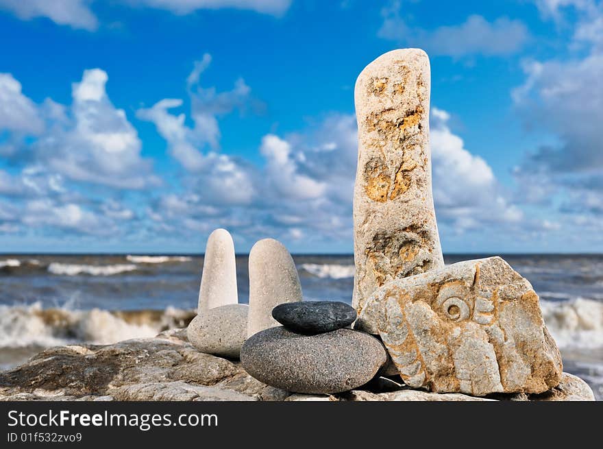 Sea pebble on seacoast in the windy morning in the summer. Sea pebble on seacoast in the windy morning in the summer