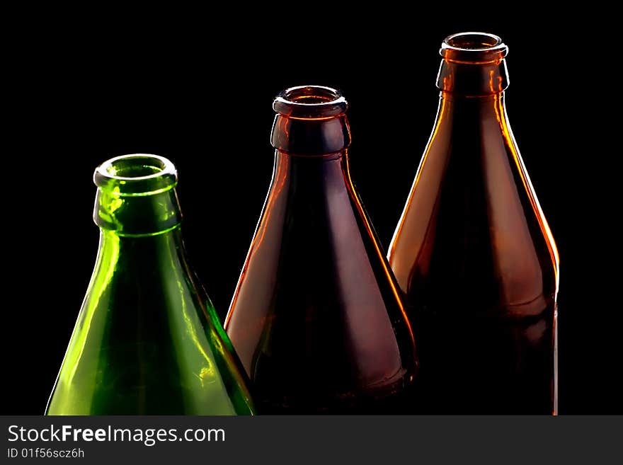 Close-up empty bottles isolated on black