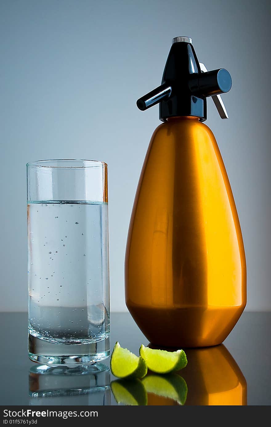 Soda Siphon with cold drink and limes. Soda Siphon with cold drink and limes