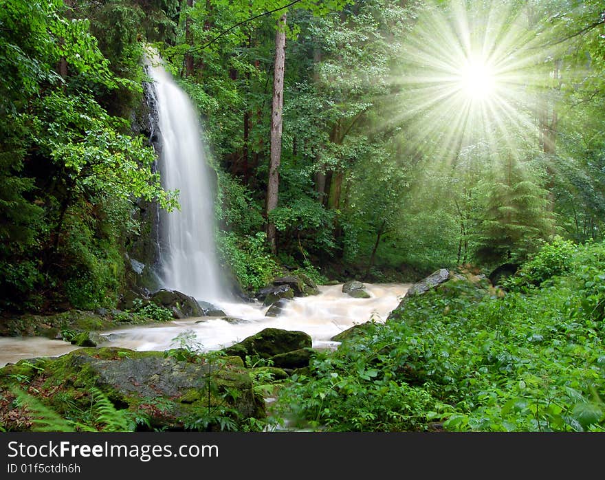 A beautiful waterfall with sun rays. A beautiful waterfall with sun rays