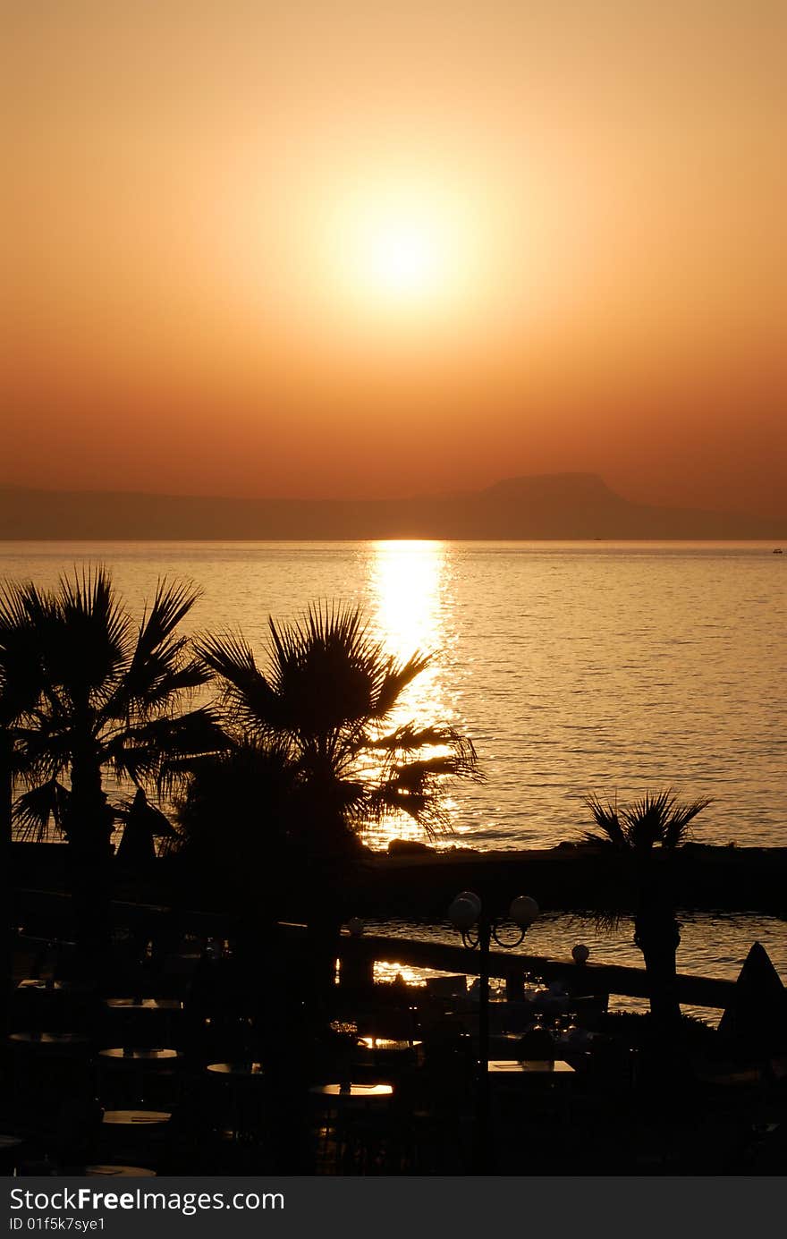 Sea and palms and sunset. Sea and palms and sunset