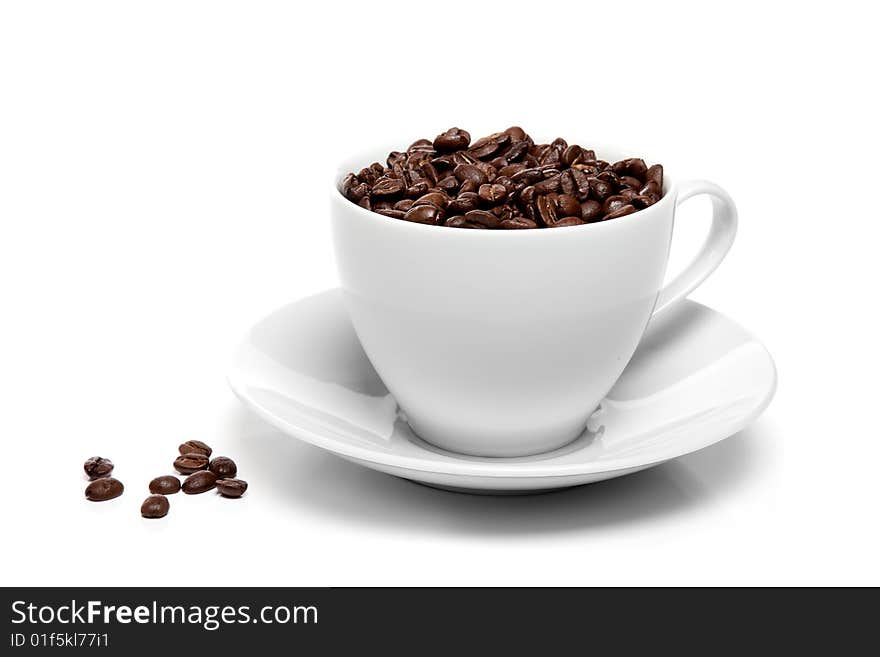 Cup of coffee beans isolated over white background