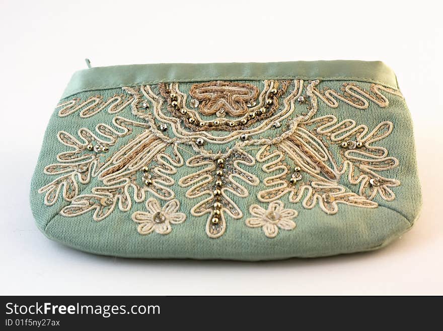 Purse with an embroidery on a white background. Purse with an embroidery on a white background