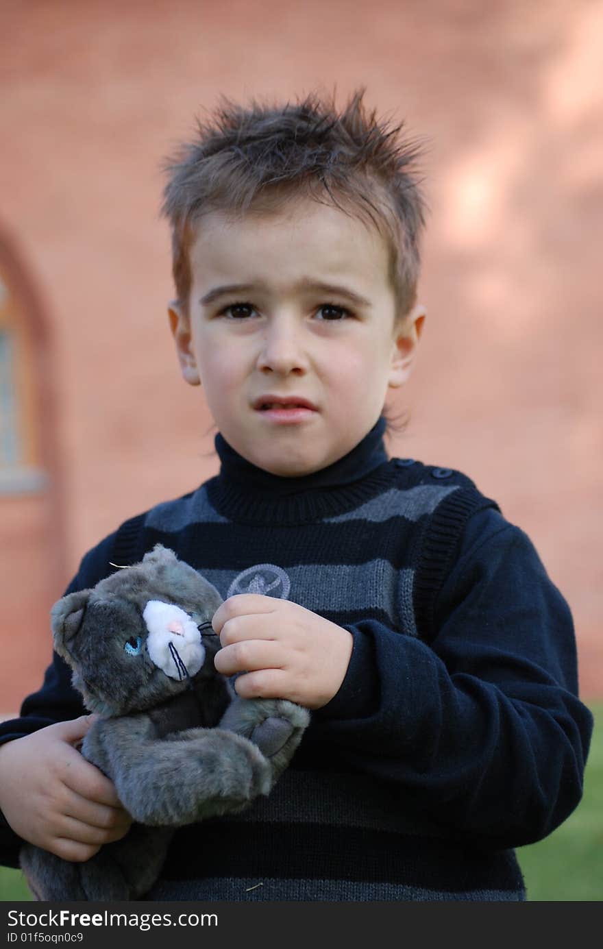 Boy with a toy kitten