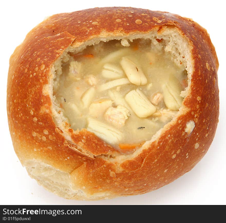 Sourdough bread filled with chicken noodle soup. Sourdough bread filled with chicken noodle soup.