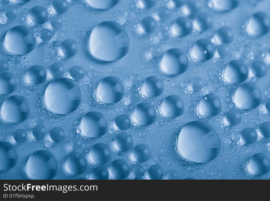 Blue water droplets background