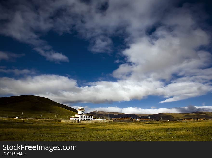 Rural view. small house under the storm sky. Rural view. small house under the storm sky.