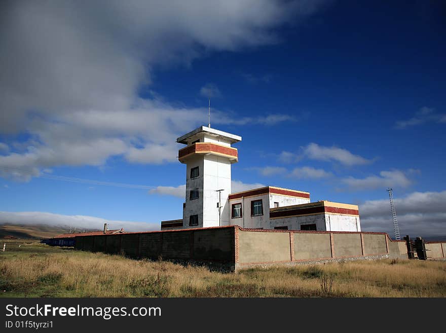 Old-fashioned house on the prairie with sky.