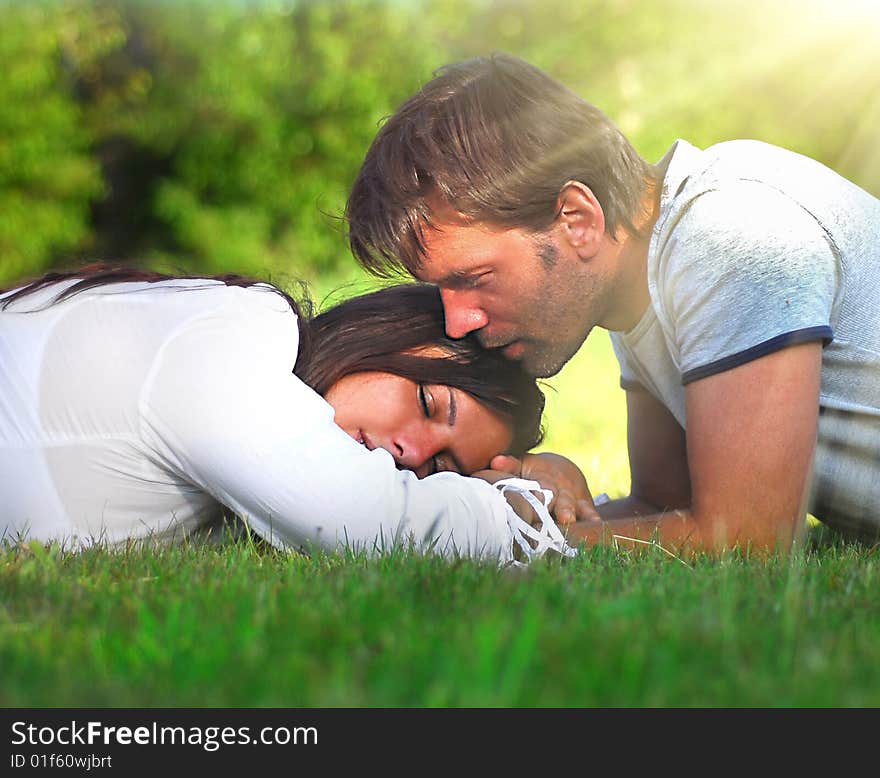 Young couple lying on the grass. Young couple lying on the grass