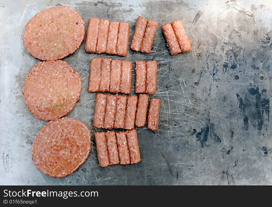 Raw meat on grill barbecue