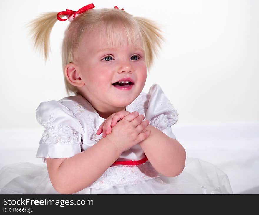 Child sits having packed hands. Child sits having packed hands