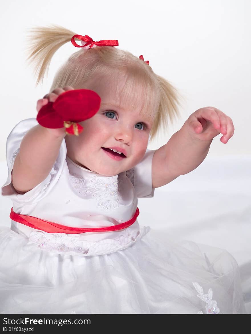 Smiling child shows heart