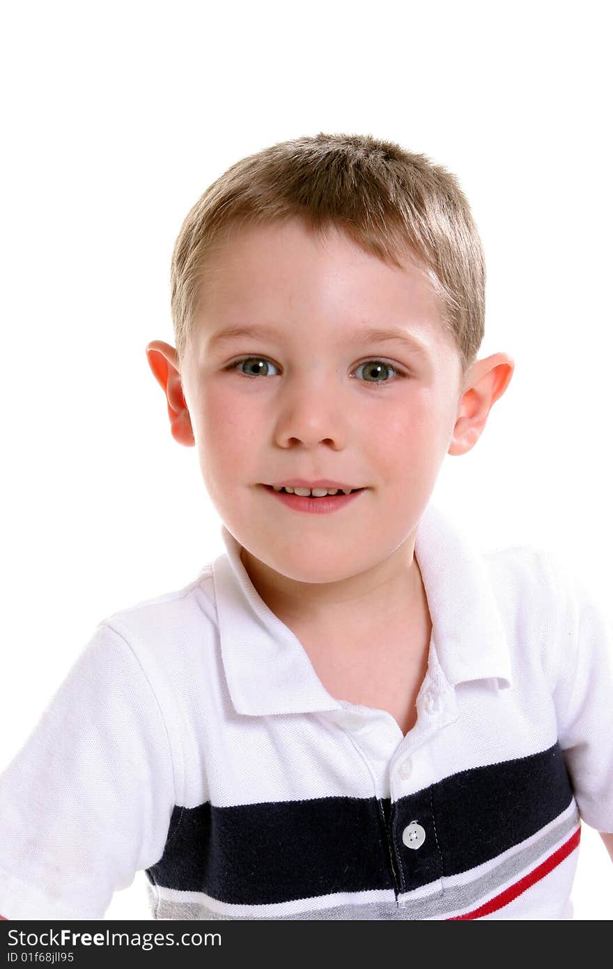 Head and shoulders portrait of cute boy smiling